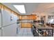 Bright kitchen with wood cabinets, granite island, and stainless steel appliances at 1745 E Mulberry Dr, Tampa, FL 33604
