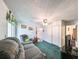 Cozy living room featuring a comfortable couch and access to a balcony at 1745 E Mulberry Dr, Tampa, FL 33604