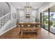 Bright dining room featuring a farmhouse table and bench at 19713 Roseate Dr, Lutz, FL 33558