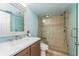 Modern bathroom with a sleek vanity, spacious shower with a built-in bench, and tiled walls at 19725 Gulf Blvd # 501, Indian Shores, FL 33785