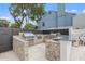 Outdoor kitchen with stainless steel grills and granite countertop at 2 Adalia Ave # 502, Tampa, FL 33606