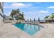 Inviting community pool with ample lounge chairs and waterfront views at 2 Adalia Ave # 502, Tampa, FL 33606