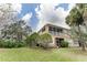 Tan building with screened balcony and lush landscaping at 2044 Santa Catalina Ln Dr # 2044, Riverview, FL 33578