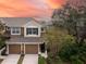 Two-story townhome with two-car garage at sunset at 2044 Santa Catalina Ln Dr # 2044, Riverview, FL 33578
