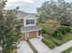 Two-story townhome with two-car garage and lush landscaping at 2044 Santa Catalina Ln Dr # 2044, Riverview, FL 33578
