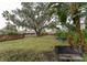 Relaxing grilling area with benches, under a large oak tree at 2044 Santa Catalina Ln Dr # 2044, Riverview, FL 33578