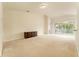 Spacious living room featuring a large window and access to a balcony at 2044 Santa Catalina Ln Dr # 2044, Riverview, FL 33578