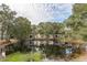 Scenic pond view with tree reflections and lush greenery at 2044 Santa Catalina Ln Dr # 2044, Riverview, FL 33578