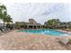 Community pool with lounge chairs and patio area at 2044 Santa Catalina Ln Dr # 2044, Riverview, FL 33578