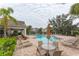 Community pool with seating and umbrellas at 2044 Santa Catalina Ln Dr # 2044, Riverview, FL 33578