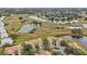 Bird's eye view of community, showcasing villas and nearby waterways at 2315 New Orchard Ct, Sun City Center, FL 33573