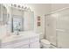 Clean bathroom with shower, toilet and vanity at 2315 New Orchard Ct, Sun City Center, FL 33573