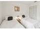 Bright bedroom with two twin beds and ample closet space at 2315 New Orchard Ct, Sun City Center, FL 33573