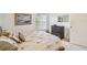 Charming bedroom with double bed, dresser and large window, overlooking the garden at 2315 New Orchard Ct, Sun City Center, FL 33573