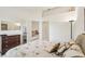Spacious bedroom with double bed, dresser, and access to living area at 2315 New Orchard Ct, Sun City Center, FL 33573