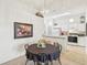 Bright dining area with a round table and kitchen view at 2315 New Orchard Ct, Sun City Center, FL 33573