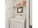 Laundry room with washer, dryer, and shelving at 2315 New Orchard Ct, Sun City Center, FL 33573