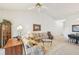 Comfortable living room with two sofas and a view to dining area at 2315 New Orchard Ct, Sun City Center, FL 33573