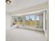 Sunroom with large windows and view of backyard at 2315 New Orchard Ct, Sun City Center, FL 33573
