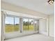 Sunroom with large windows and view of backyard at 2315 New Orchard Ct, Sun City Center, FL 33573