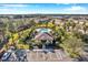 Aerial view showcasing community clubhouse, pool, and guest parking amidst lush landscaping at 2517 Edgewater Falls Dr, Brandon, FL 33511