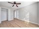 Bright bedroom with a ceiling fan and natural light that illuminates the wood-look flooring at 2517 Edgewater Falls Dr, Brandon, FL 33511