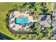 Aerial view of community pool with lounge chairs and meticulously landscaped surroundings at 2517 Edgewater Falls Dr, Brandon, FL 33511