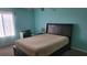 Bright bedroom with a double bed, desk, and window at 255 114Th N Ave # 4, St Petersburg, FL 33716