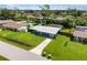 Aerial view of a single-Gathering home with a pool and fenced backyard at 3064 Pinetree St, Port Charlotte, FL 33952