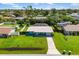 Aerial view of a single-Gathering home with a pool and fenced backyard at 3064 Pinetree St, Port Charlotte, FL 33952