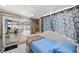 Bright bedroom with daybed and access to a patio at 3064 Pinetree St, Port Charlotte, FL 33952