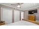 Bedroom with wooden sleigh bed and built-in dresser at 3064 Pinetree St, Port Charlotte, FL 33952