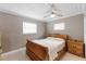 Bedroom with wooden sleigh bed and ceiling fan at 3064 Pinetree St, Port Charlotte, FL 33952