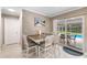 Casual dining area with table and chairs, near the kitchen and pool at 3064 Pinetree St, Port Charlotte, FL 33952