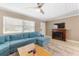 Living room with sectional sofa and fireplace at 3064 Pinetree St, Port Charlotte, FL 33952