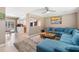 Open living space featuring a comfortable sectional sofa and kitchen view at 3064 Pinetree St, Port Charlotte, FL 33952