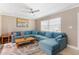 Spacious living room with sectional sofa and wood floors at 3064 Pinetree St, Port Charlotte, FL 33952