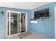 Outdoor patio with sliding door access to the house at 3064 Pinetree St, Port Charlotte, FL 33952