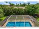 Inviting screened pool with ample surrounding space at 3064 Pinetree St, Port Charlotte, FL 33952