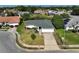 Single-Gathering home with a two-car driveway and pond view at 3127 Ivyhill Ct, Holiday, FL 34691