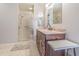 Bathroom with granite vanity, large shower, and tiled floors at 3127 Ivyhill Ct, Holiday, FL 34691