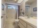 Bathroom with tub, shower, and updated vanity at 3127 Ivyhill Ct, Holiday, FL 34691