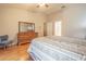 Main bedroom with wood floors and access to en-suite bathroom at 3127 Ivyhill Ct, Holiday, FL 34691