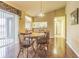 Bright dining room with hardwood floors and a charming wooden table set at 3127 Ivyhill Ct, Holiday, FL 34691