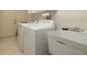 Laundry room features a utility sink and space for a washer and dryer at 3127 Ivyhill Ct, Holiday, FL 34691