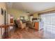 Spacious living room with hardwood floors, comfortable furniture and large windows at 3127 Ivyhill Ct, Holiday, FL 34691