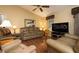 Bright living room featuring hardwood floors and ample seating at 3127 Ivyhill Ct, Holiday, FL 34691