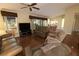 Spacious living room with hardwood floors, offering views into dining area at 3127 Ivyhill Ct, Holiday, FL 34691