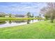 Waterfront property with lush green lawn at 3127 Ivyhill Ct, Holiday, FL 34691