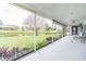 Spacious screened porch overlooking backyard and pond at 3127 Ivyhill Ct, Holiday, FL 34691
